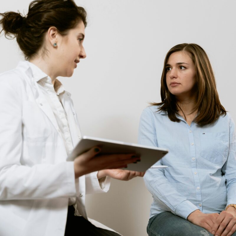 woman receiving test results at an urgent care clinic