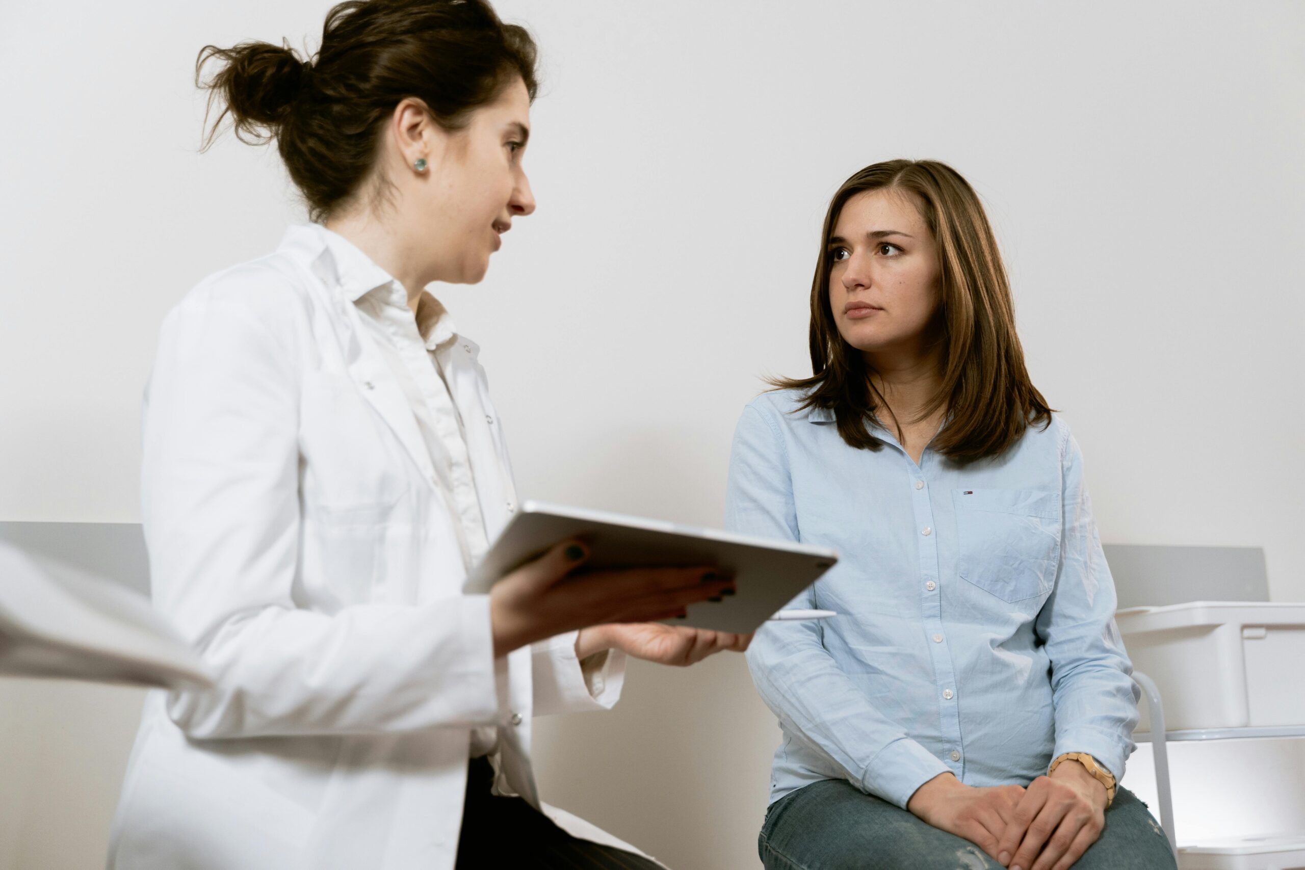 woman receiving test results at an urgent care clinic